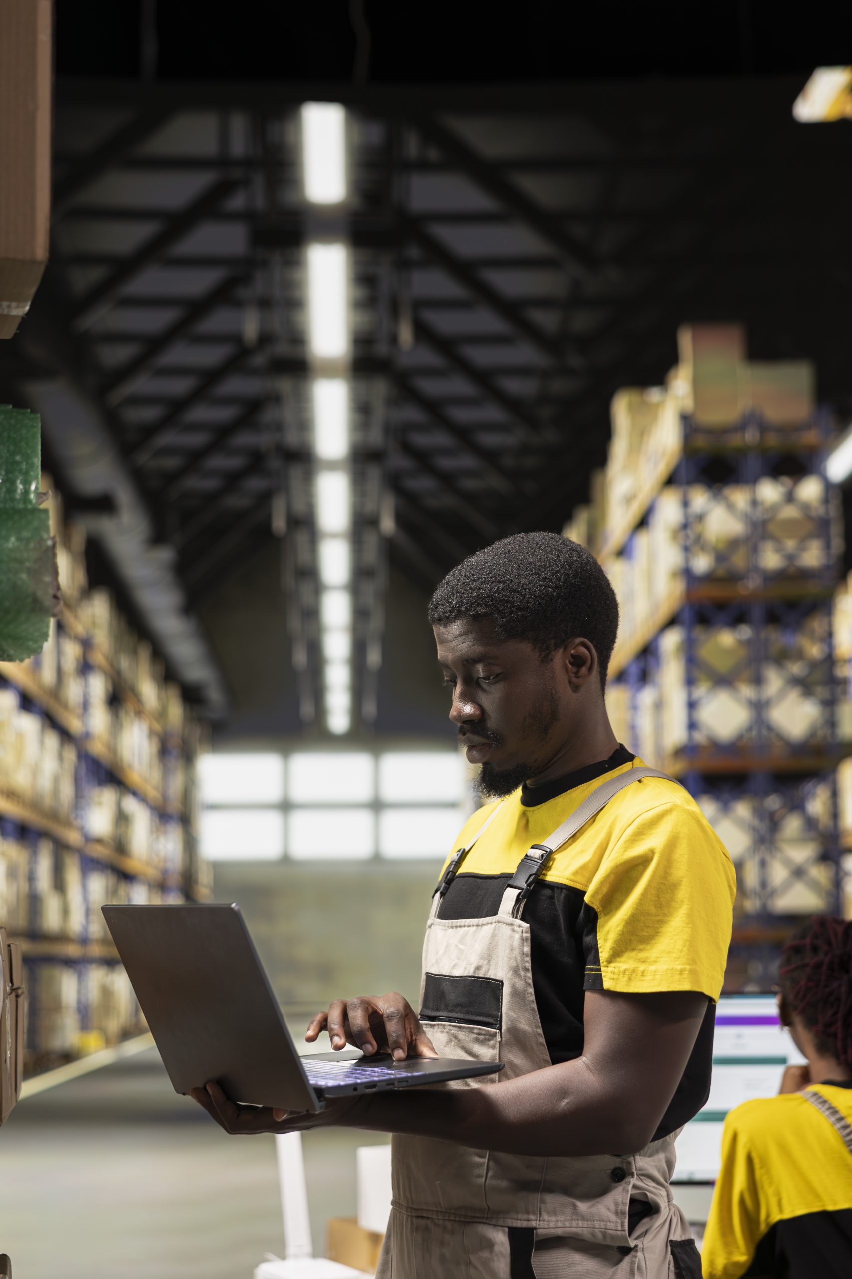 warehouse technician inspecting cargo details on shelves